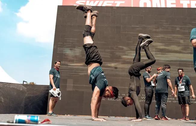 Participants performing handstands